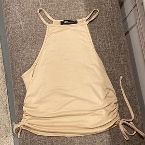 Cream/tan colored tank top that ties on the sides